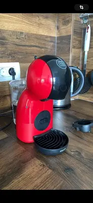a red toaster sitting on top of a wooden table at Luxury Apart near Lake Bohinj in Bohinj