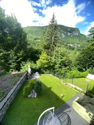 a garden with a view of a mountain at Luxury Apart near Lake Bohinj in Bohinj