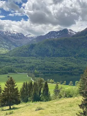 a view of a valley with a lake and mountains at Luxury Apart near Lake Bohinj in Bohinj