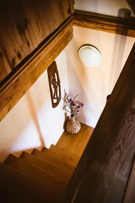 a stairway with a vase with flowers in it at Počitniška hiša Car in Dobrovnik