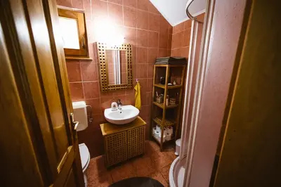 a small bathroom with a sink and a toilet at Počitniška hiša Car in Dobrovnik