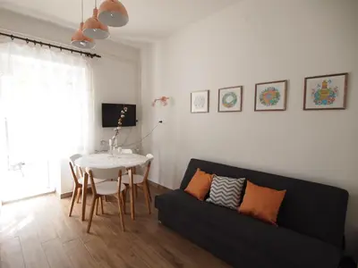 a living room with a couch and a table at In the Center of Rogaška Slatina! Apartment Fani and Studio Marija in Rogaška Slatina