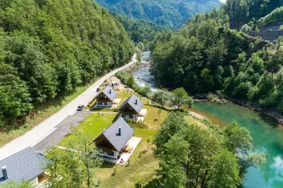 an aerial view of a house next to a river at Riverside Resort Stari Malni Kolpa in Osilnica