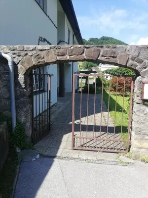 an entrance to a building with an iron gate at Maestro I. in Laško