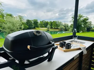 a grill sitting on a kitchen counter next to a window at KOLPA - Luxury Natura House in Gradac