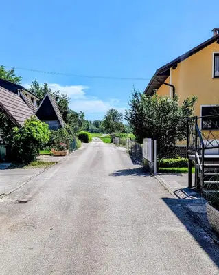 an empty road in front of a house at Domen's cozy rentals in Kranj