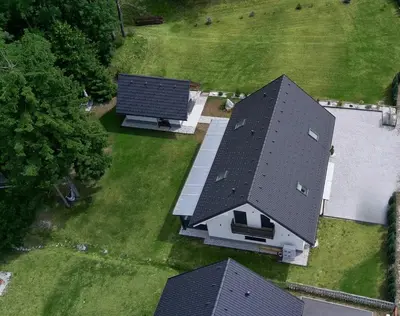 an overhead view of a house with a large roof at Riverside Apartma 1, Kranjska Gora in Kranjska Gora