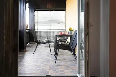 a dining room with a table and chairs in a room at Apartma Maka in Maribor
