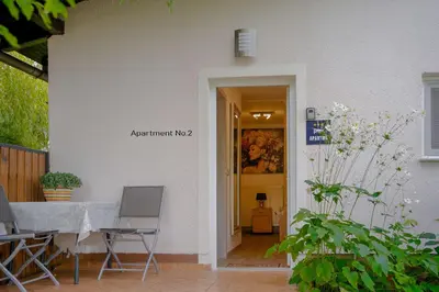 a table and chairs sitting outside of a building at Apartma Maka in Maribor