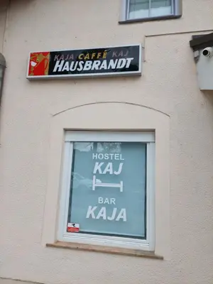a window with a sign on the side of a building at Apartma Kaj in Kaja in Maribor