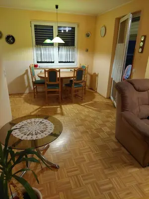 a living room with a table and a couch at Apartma Kaj in Kaja in Maribor