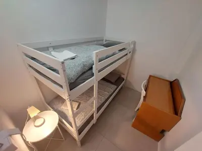 an overhead view of a bunk bed in a room at ROSE VALLEY, modern studios & apartments in Ljubljana