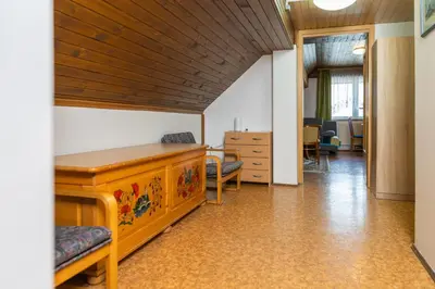 an office with a desk and chairs in a room at Apartments Darinka Mencinger in Bohinj