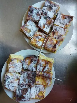 two plates of food with slices of pizza on them at Turistično - Izletniška kmetija Žerjav in Brežice