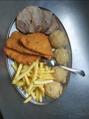 a plate of food with meat and french fries at Turistično - Izletniška kmetija Žerjav in Brežice