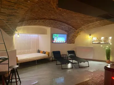 a living room with a couch and two chairs at Celje Luxury Apartment in Celje