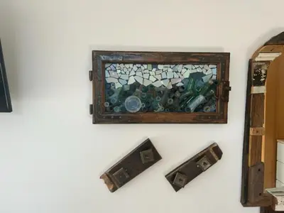 a stained glass window hanging on a wall at A&E Apartment in Ljubljana