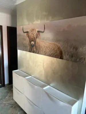 a painting of a bull with horns on a wall at A&E Apartment in Ljubljana