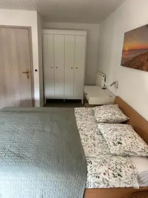 a bedroom with a bed and a sink in it at A&E Apartment in Ljubljana