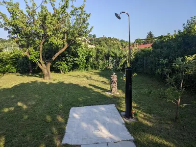 a street light sitting in the middle of a yard at Počitniška hiša Hum in Kojsko
