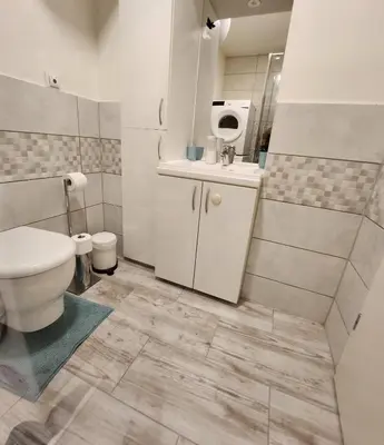 a bathroom with a toilet and a sink at Studio Apartma V8 in Maribor