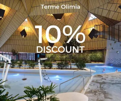 a swimming pool in a building with the words percent discount at VILA LISJAK - Apartments in Podčetrtek