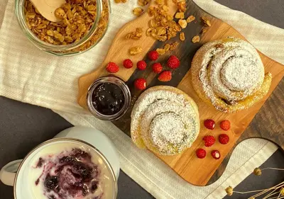 a table with a cutting board with bread and berries at Charming Bella Hideout - Adults Only in Jesenice