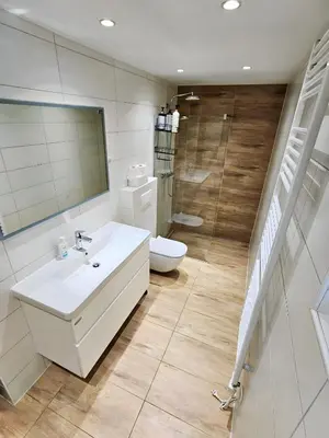 a bathroom with a sink and a toilet and a mirror at Charming Bella Hideout - Adults Only in Jesenice