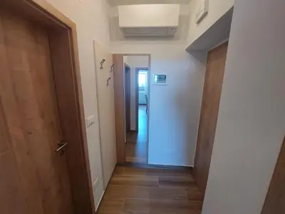 a hallway with a door leading into a room at Prenočišča v Kraški Hiši in Komen