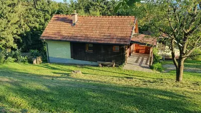 a small house in the middle of a field at Hiška ob gozdu in Polzela