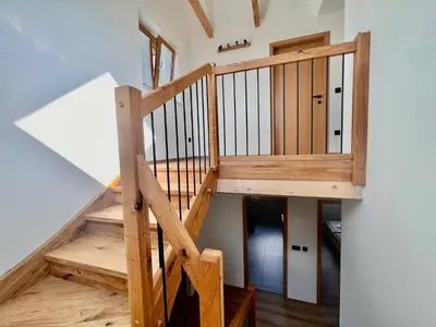 a wooden staircase leading up to a loft at Vila Milan in Bled