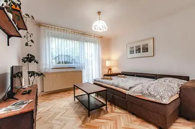 a living room with a couch and a table at Apartment Vita in Bled