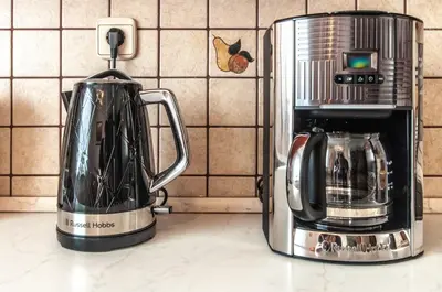 a coffee maker and a toaster on a kitchen counter at Apartment Vita in Bled
