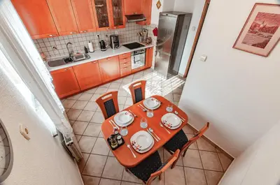 an overhead view of a kitchen with a table and chairs at Apartment Vita in Bled