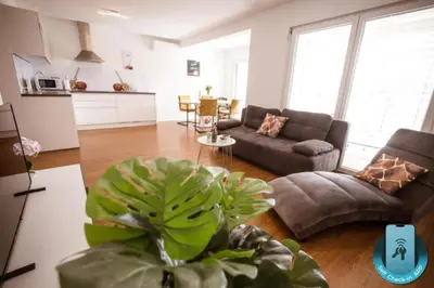 a living room with a couch and a table at Apartma Sofija, Moravski Dvori in Moravske Toplice