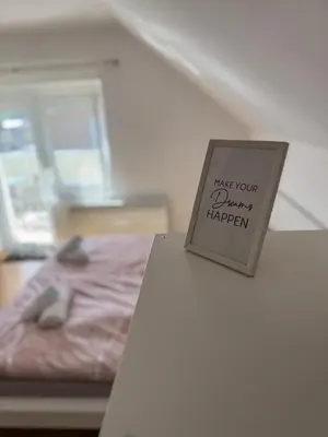 a sign that says have your drawings happen on a table at Green House Apartment in Pivka