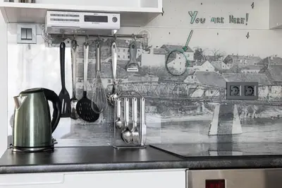 a kitchen counter with utensils on a wall at Apartment MaRI&BoR-No Stairs, Easy Access, Garage optional in Maribor