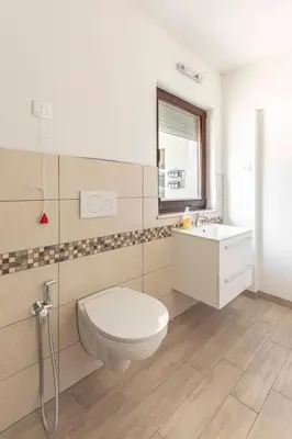 a bathroom with a toilet and a sink at Vila ART in Ljubljana
