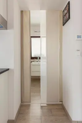 a hallway with a bathroom with a sink at Vila ART in Ljubljana