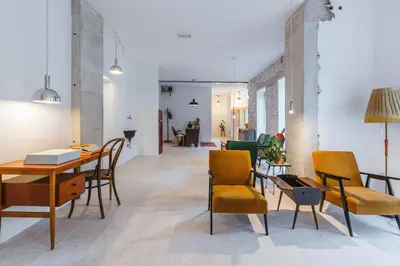 a living room with a table and chairs at 2nd Station Hostel in Bled
