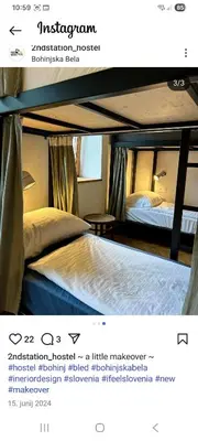 a screenshot of a hotel room with a bed at 2nd Station Hostel in Bled