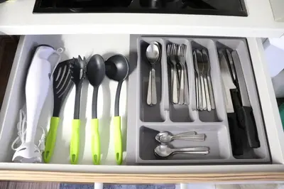 a drawer filled with forks and spoons and utensils at Apartma Luca, Bovec in Bovec