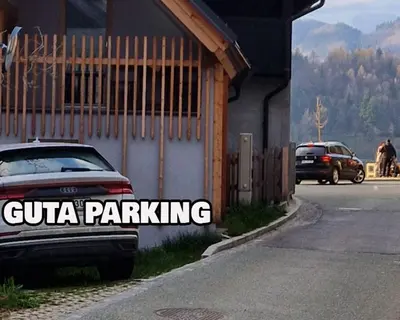 a car parked next to a building with the words cuba parking at GUTA in Bled