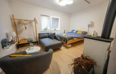 a living room with a couch and a fireplace at Casa No. 51 in Kog