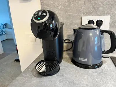 a blender and a tea kettle on a counter at Villa Kovačeva apartments, Marice Kovačeve 15, app 1, free parking in Ljubljana