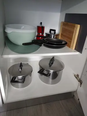 a kitchen with two pots and pans on a stove at Apartma Eda, Bovec in Bovec