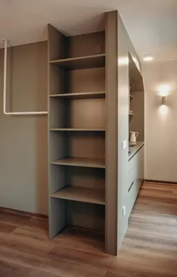 a closet in a room with shelves at Apartments Triglav in Mojstrana