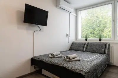 a bedroom with a bed with two towels on it at Apartma Nadja in Maribor