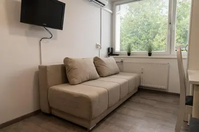 a living room with a couch and a tv at Apartma Nadja in Maribor