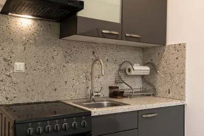 a kitchen with a sink and a stove at Apartma Nadja in Maribor